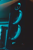 Close-up of the device speaker playing audio with sound waves visible