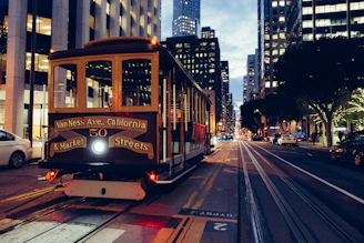 yellow and maroon city train