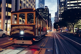 yellow and maroon city train