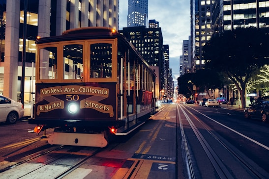 yellow and maroon city train