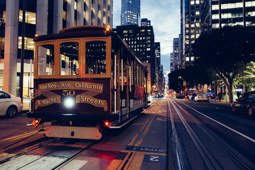 yellow and maroon city train,