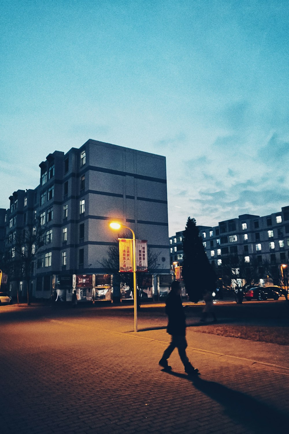 man walking along the street in the city