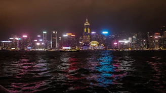 Night city skyline glowing, perfect backdrop for all-night bookings.