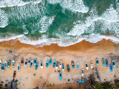 aerial photography of boats on shore during daytime