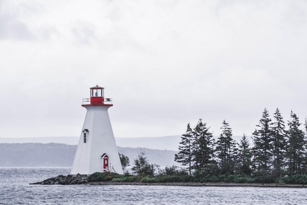 white lighthouse and body of water