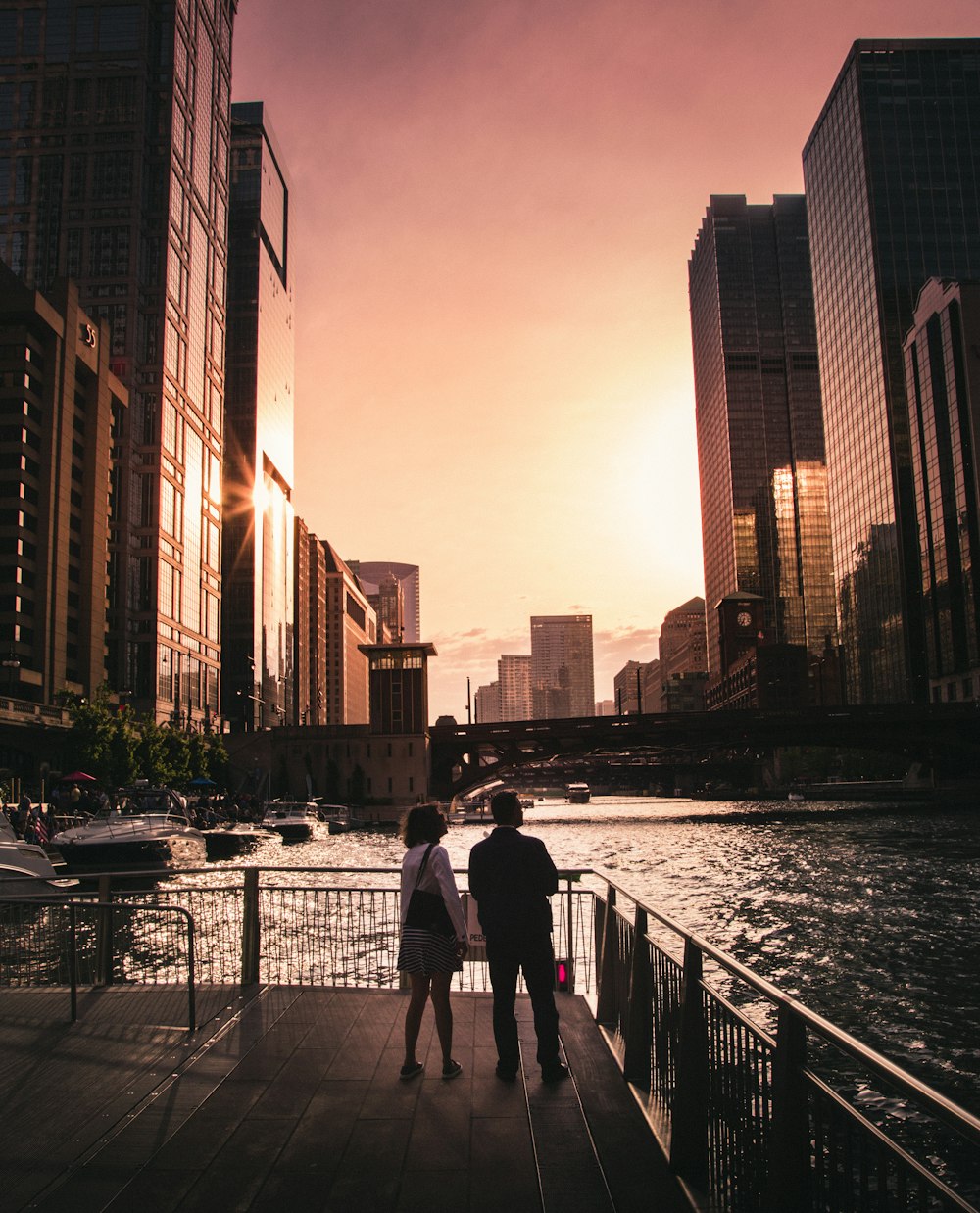 couple standing near the fence photography