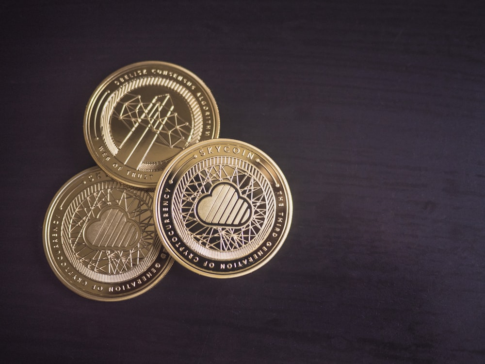 three round gold-colored coins