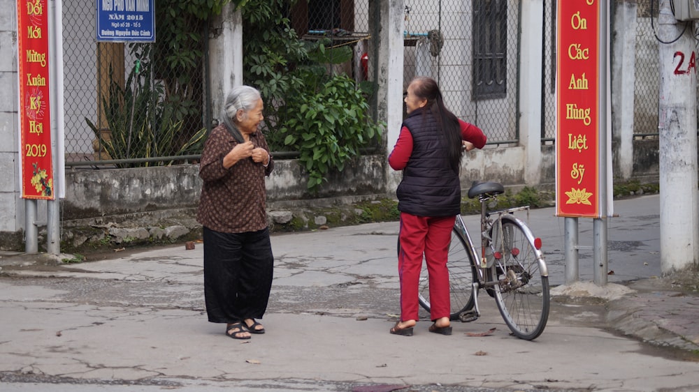 two women talking on road