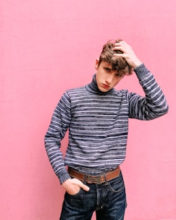 man touching his head