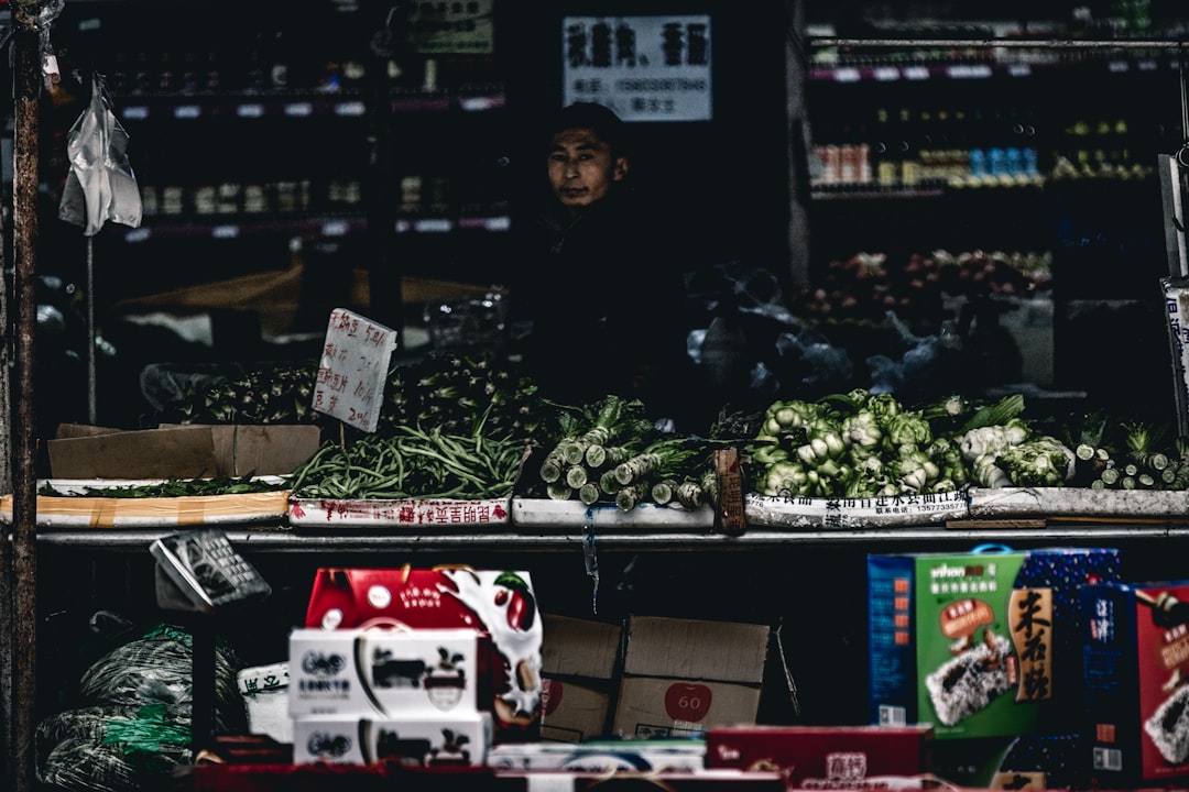 man in vegetable store