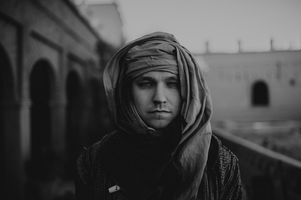 grayscale photo of man wearing headscarf