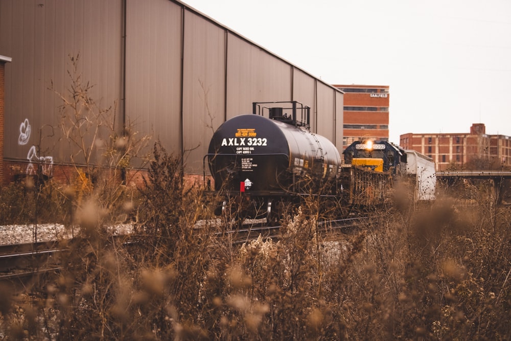 black tanker train on railroad