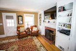 Inviting fireplace in the living room with comfortable armchairs.