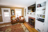 A cozy living room featuring custom built-ins and fresh paint.