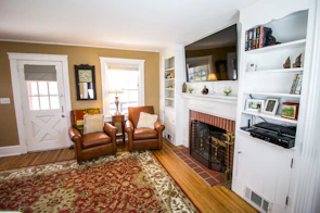 A cozy living room featuring custom built-ins and fresh paint.