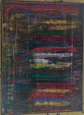 A colorful abstract artwork featuring bold strokes and vibrant colors.