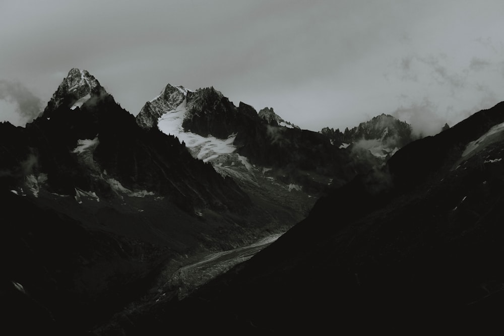 a black and white photo of a mountain range