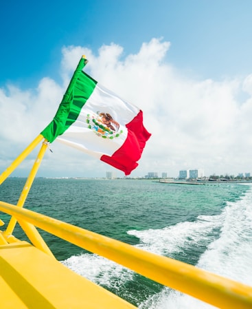 Mexico flag on yellow boat
