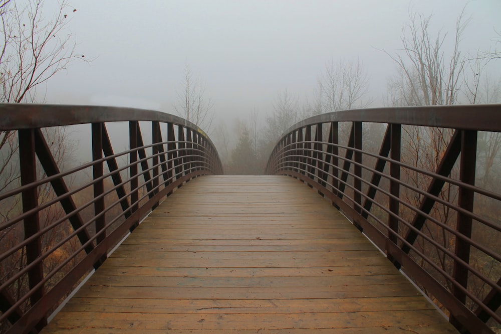 empty brown wooden arch bridge