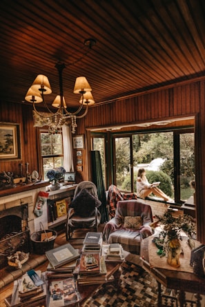 A cozy living room with a fireplace and chimney visible.