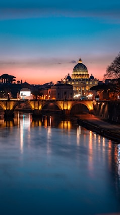 brown mosque near bridge under blue sky