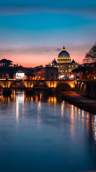 brown mosque near bridge under blue sky