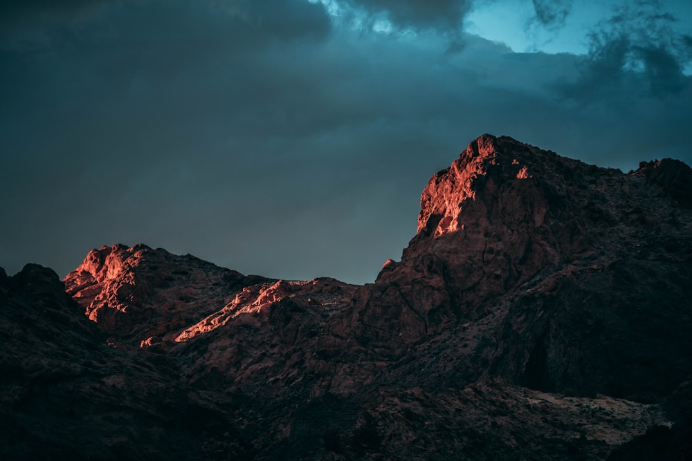 brown mountain on cloudy day