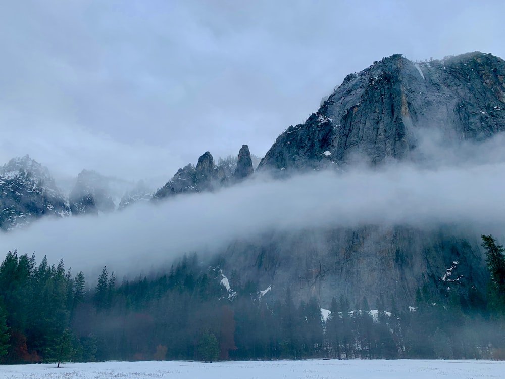 black rock mountain with white clouds