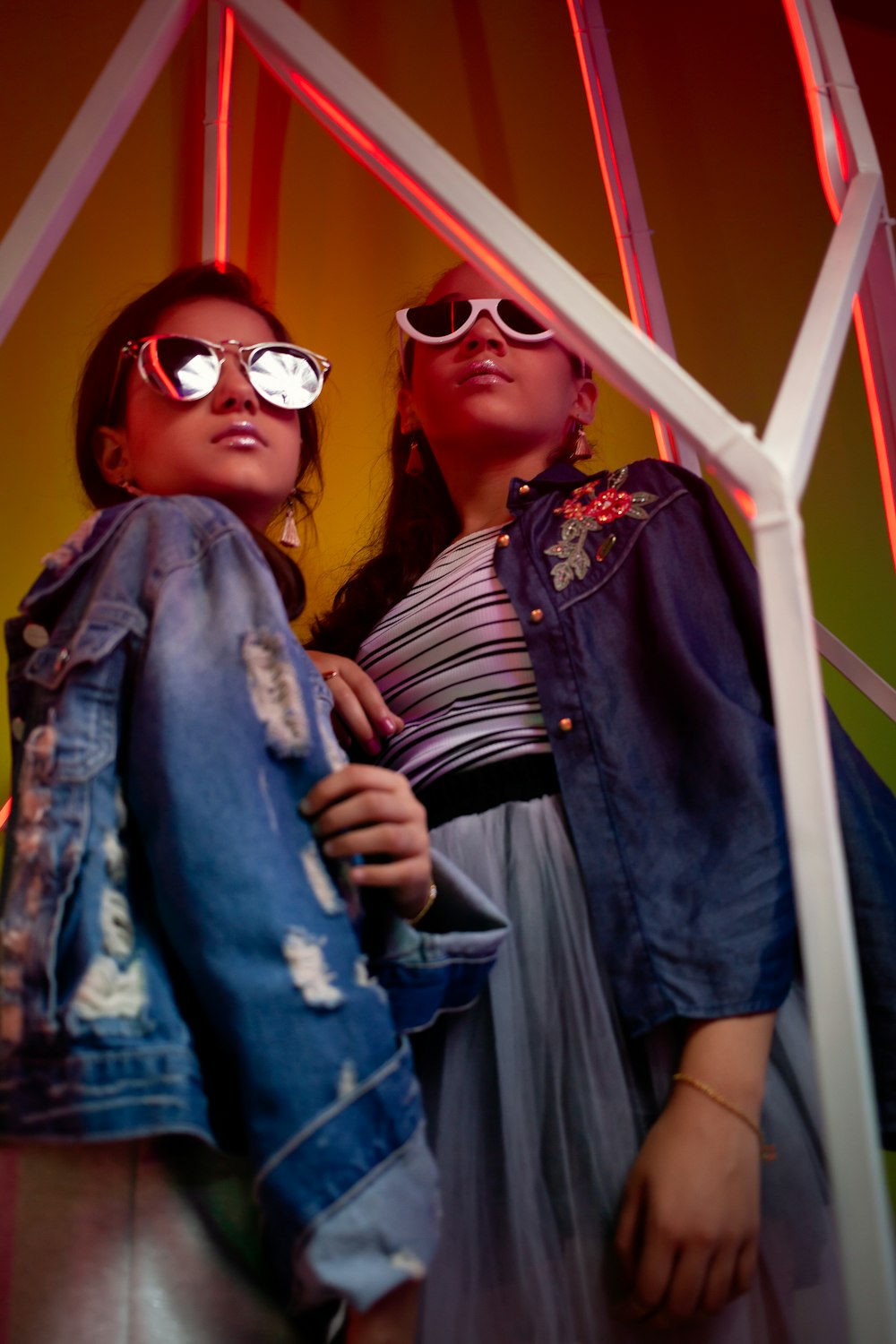 two woman standing on focus photography