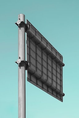 gray metal signboard during daytime
