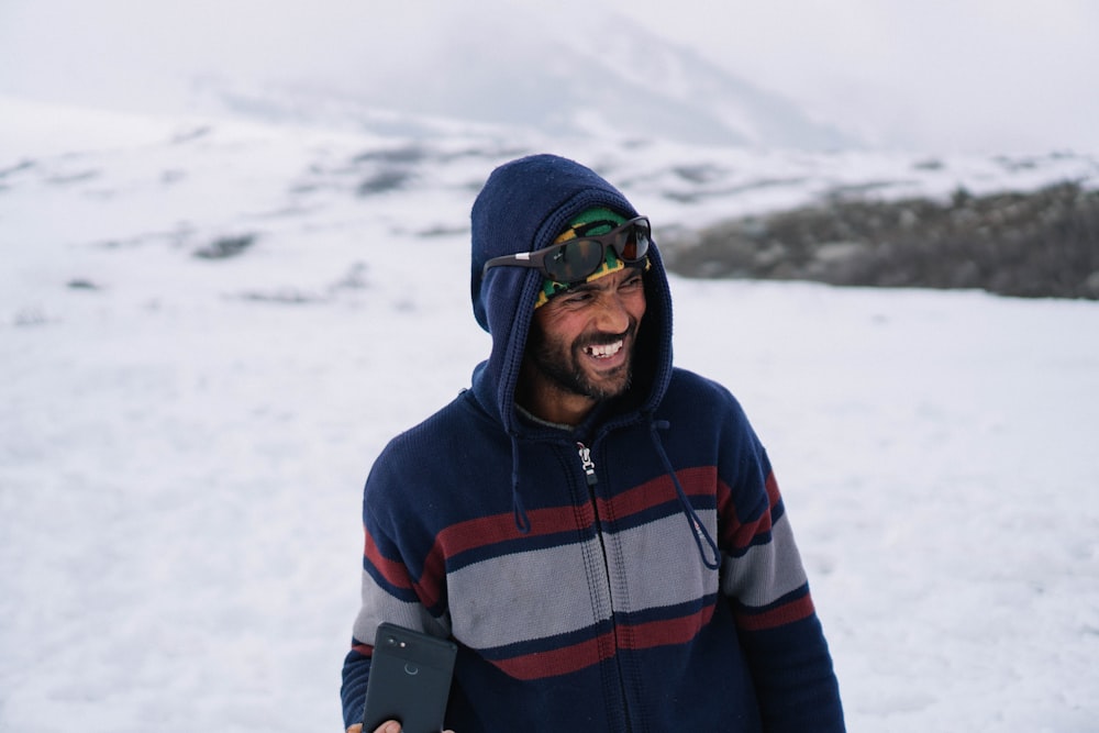 selective focus photography of man wearing zip-up hoodie