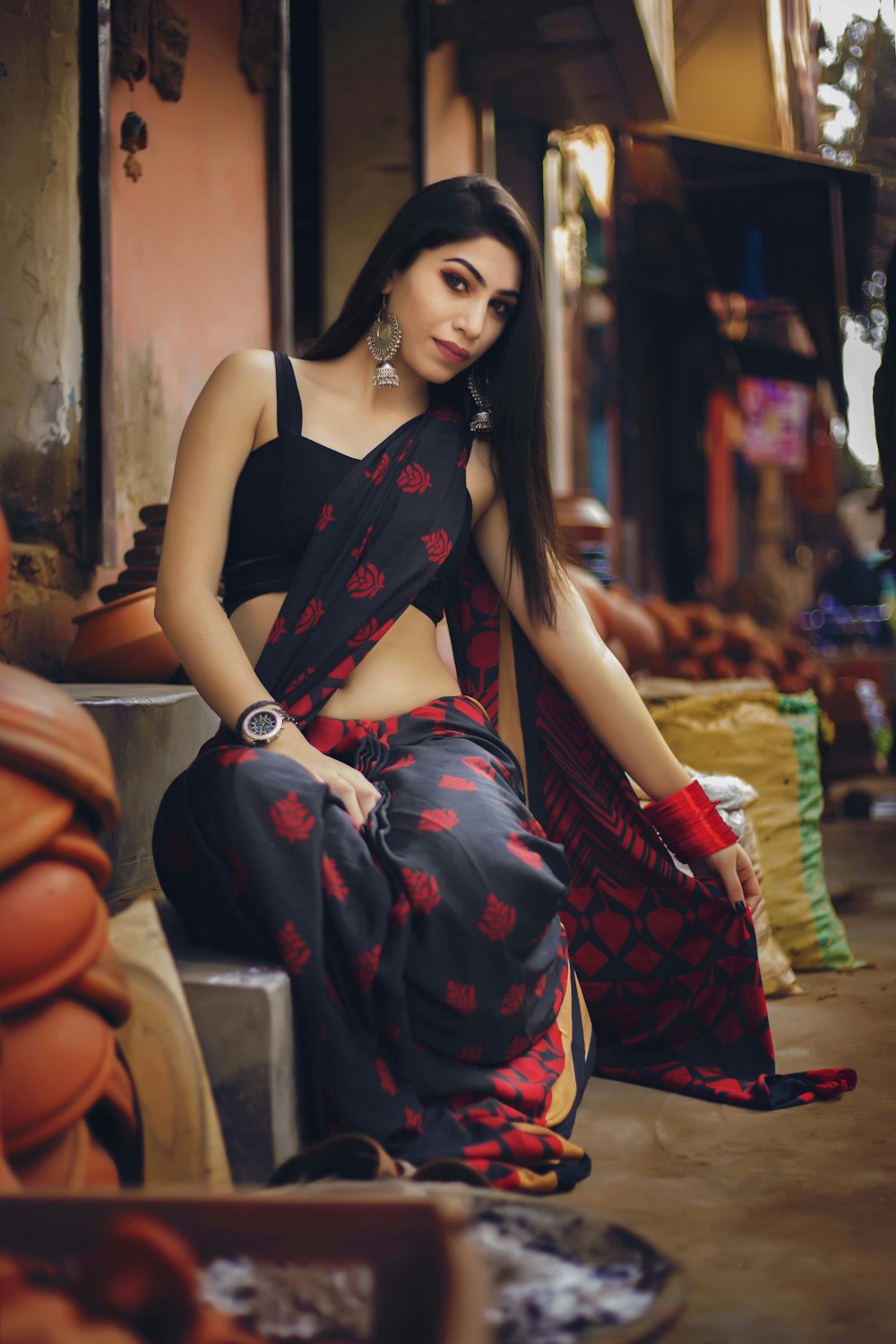 woman in salwar kameez sitting on concrete stairs