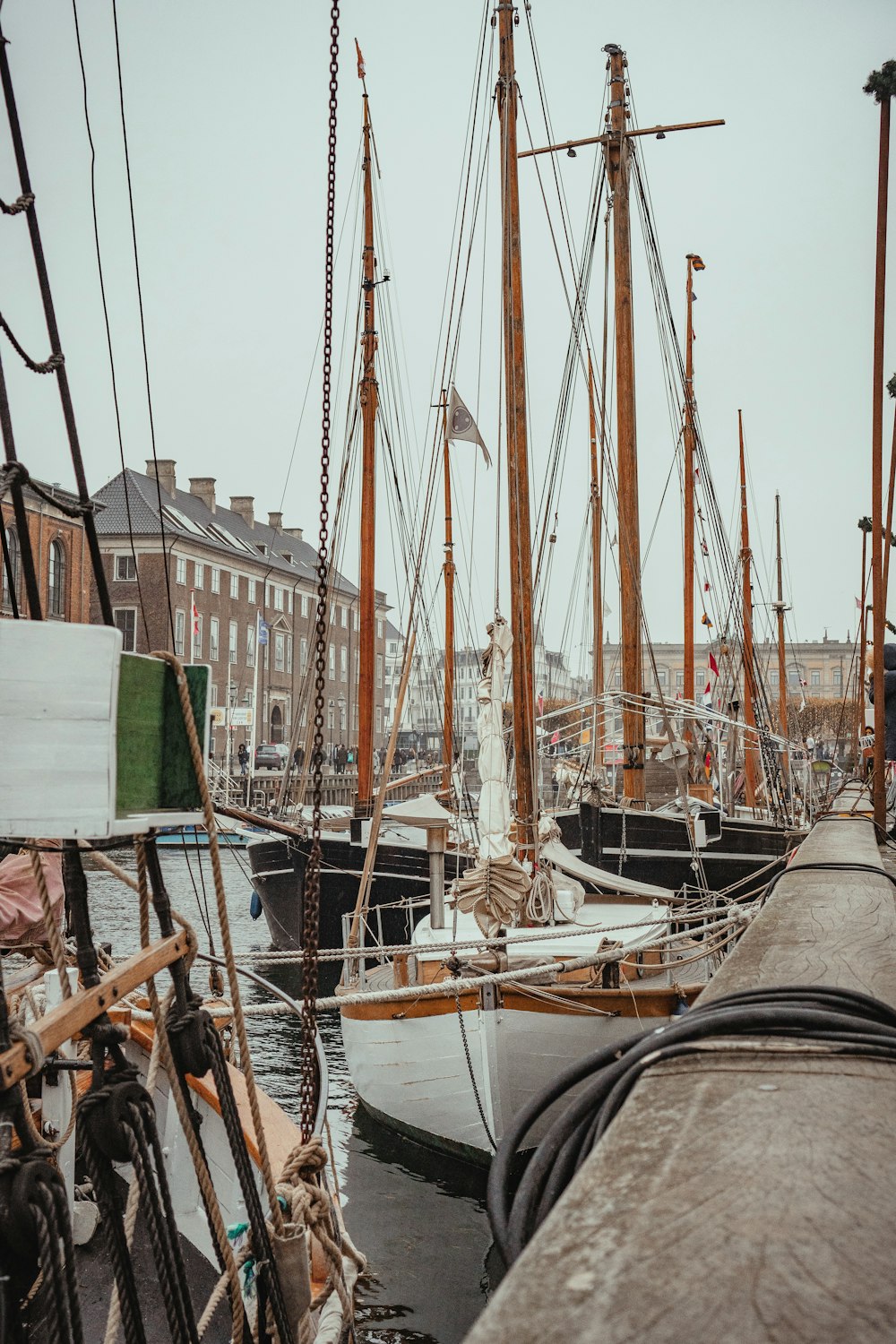 boats beside dock during day