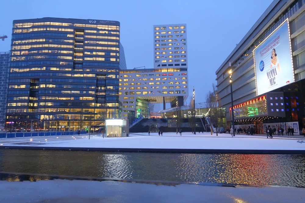 a couple of buildings that are next to a body of water