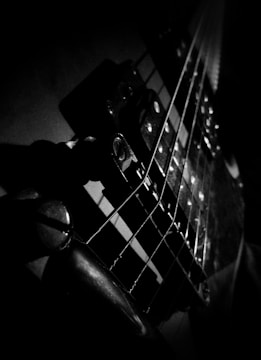 Abstract black and white image of guitar strings in detail