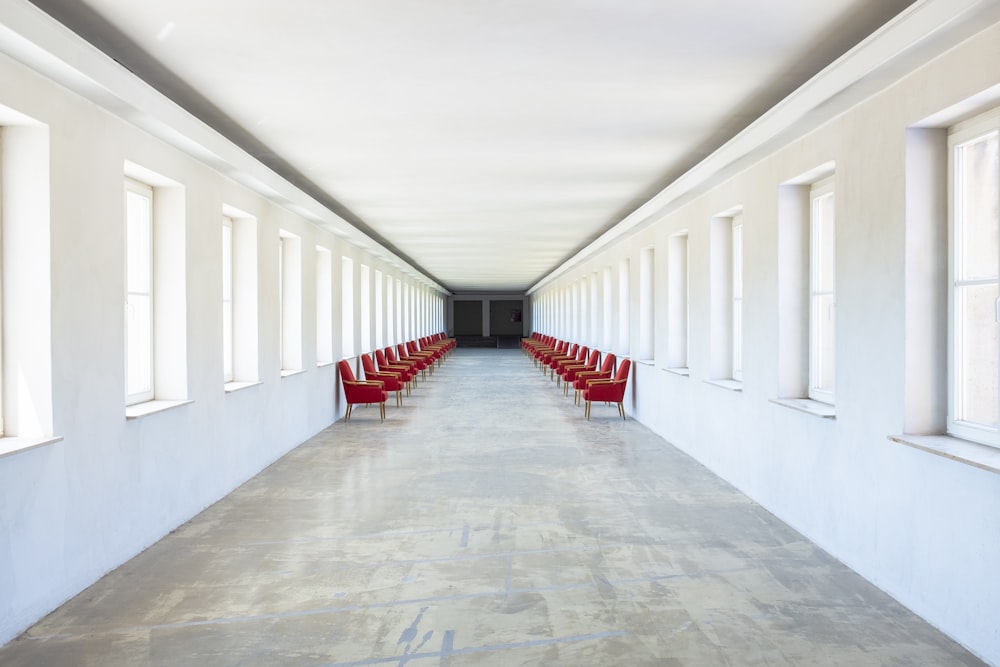 inline chairs placed against walls of hallway