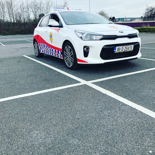Students practicing driving in a parking lot.