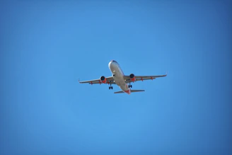 Professional flight line with pilots conducting pre-flight checks under clear skies.