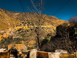Rolls of geotextile fabric laid out on a rocky hillside near Patagonian mountains.