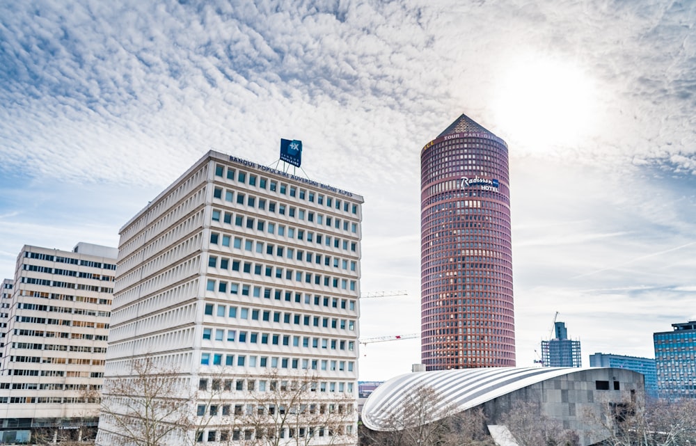 beige concrete building under white cloudy sky