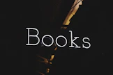 the words books are lit up in the dark