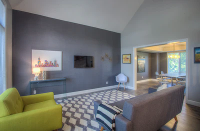 A modern living room wall freshly painted in a warm, inviting color.