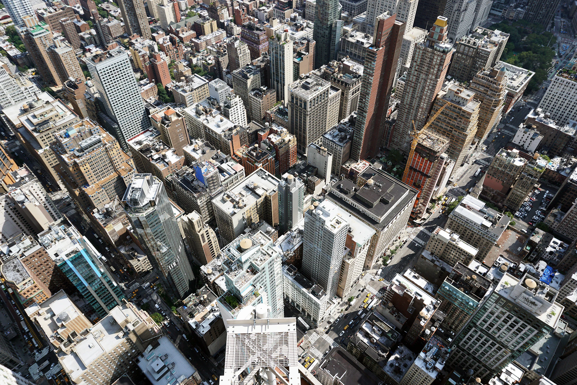 Aerial view of a dense global city skyline at dusk