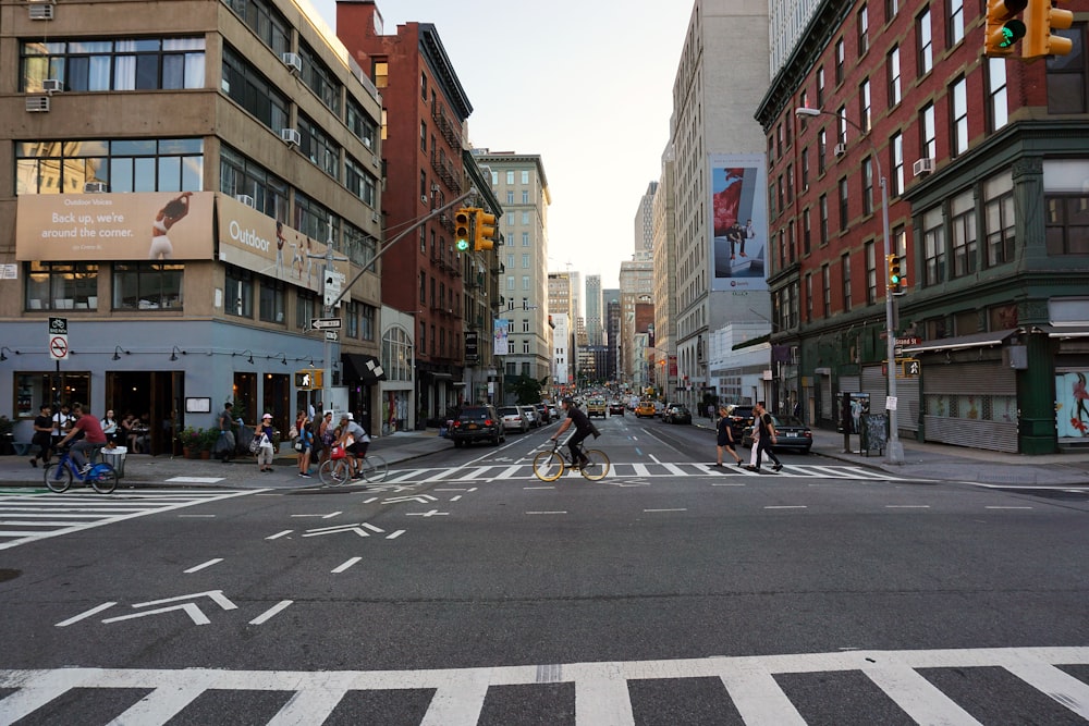 man riding bicycle at middle of street