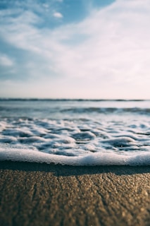 A close-up of soft waves lapping at the shore.