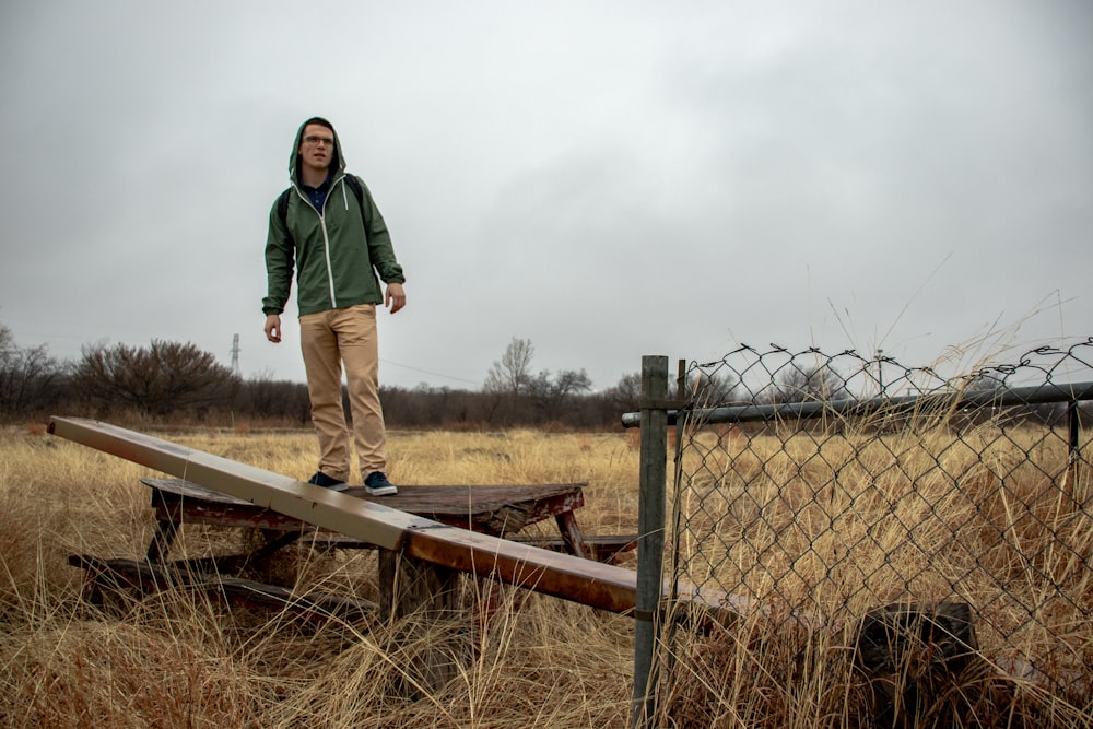 man wearing green jacket