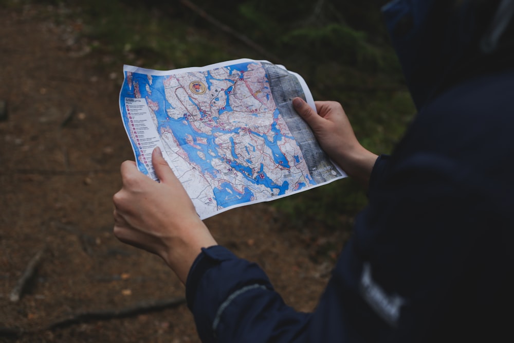 a person holding a map in their hand