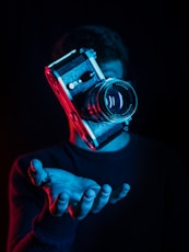 person holding DSLR camera