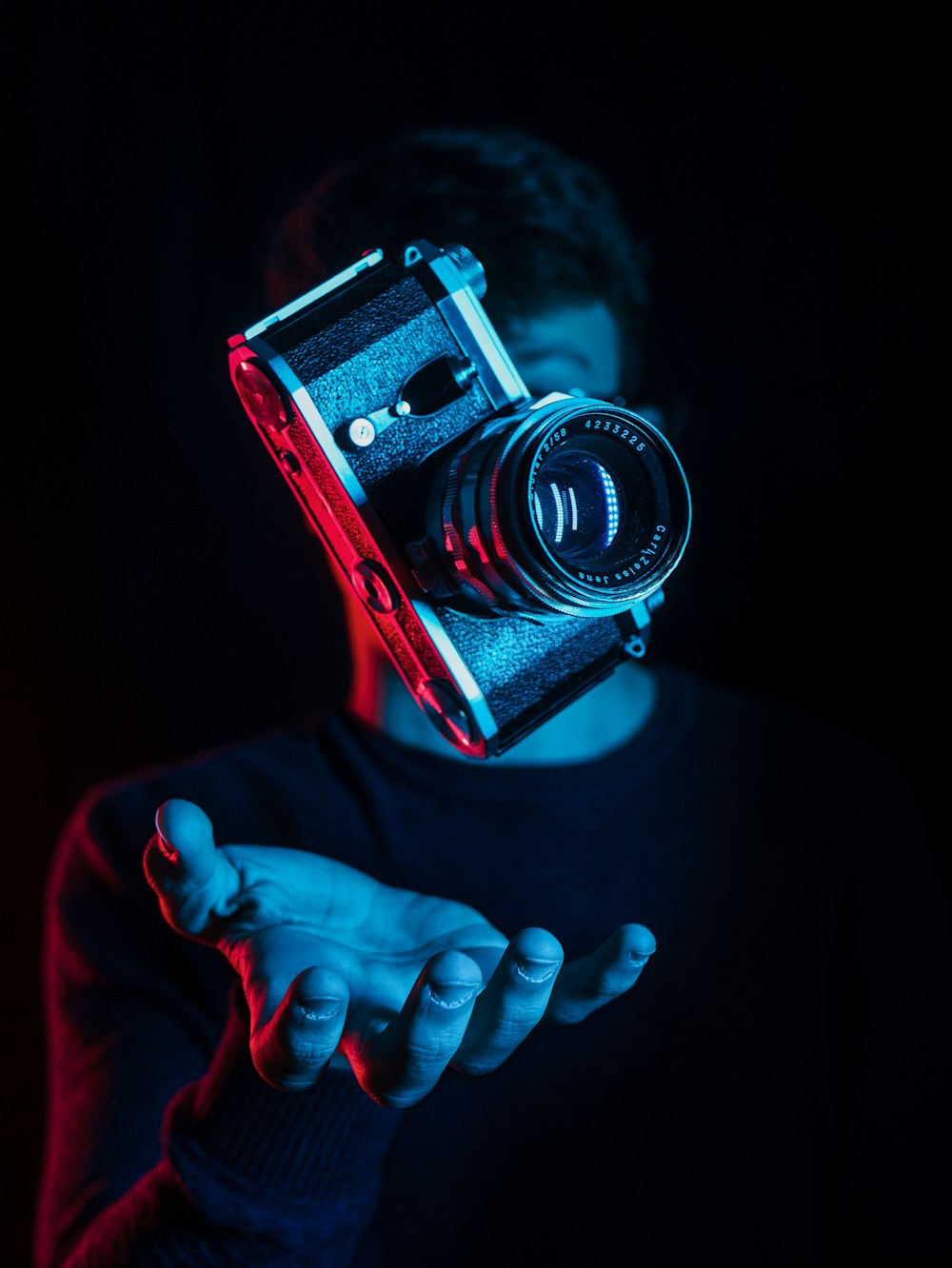 person holding DSLR camera