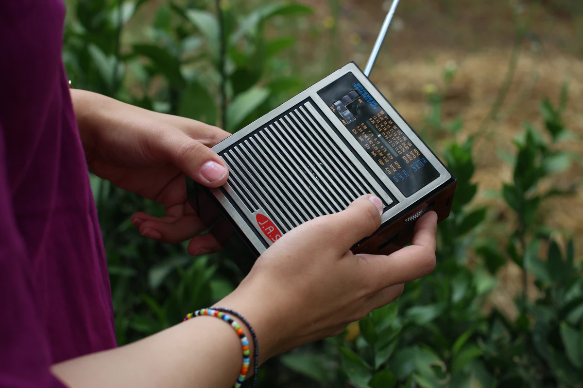Hand holding a portable radio